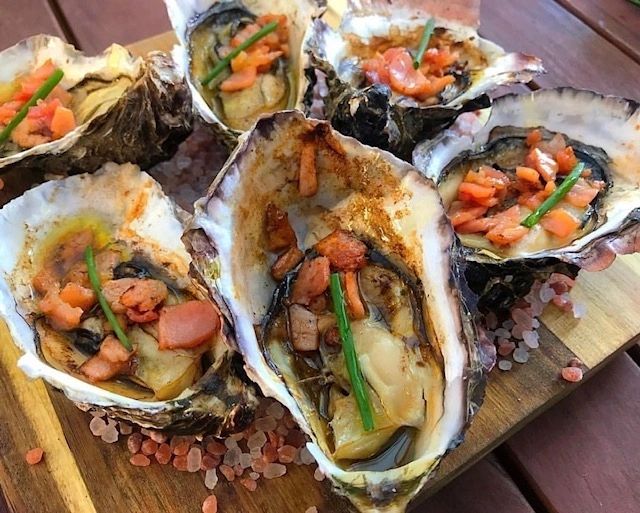 Oysters Kilpatrick Cooked Over Fire